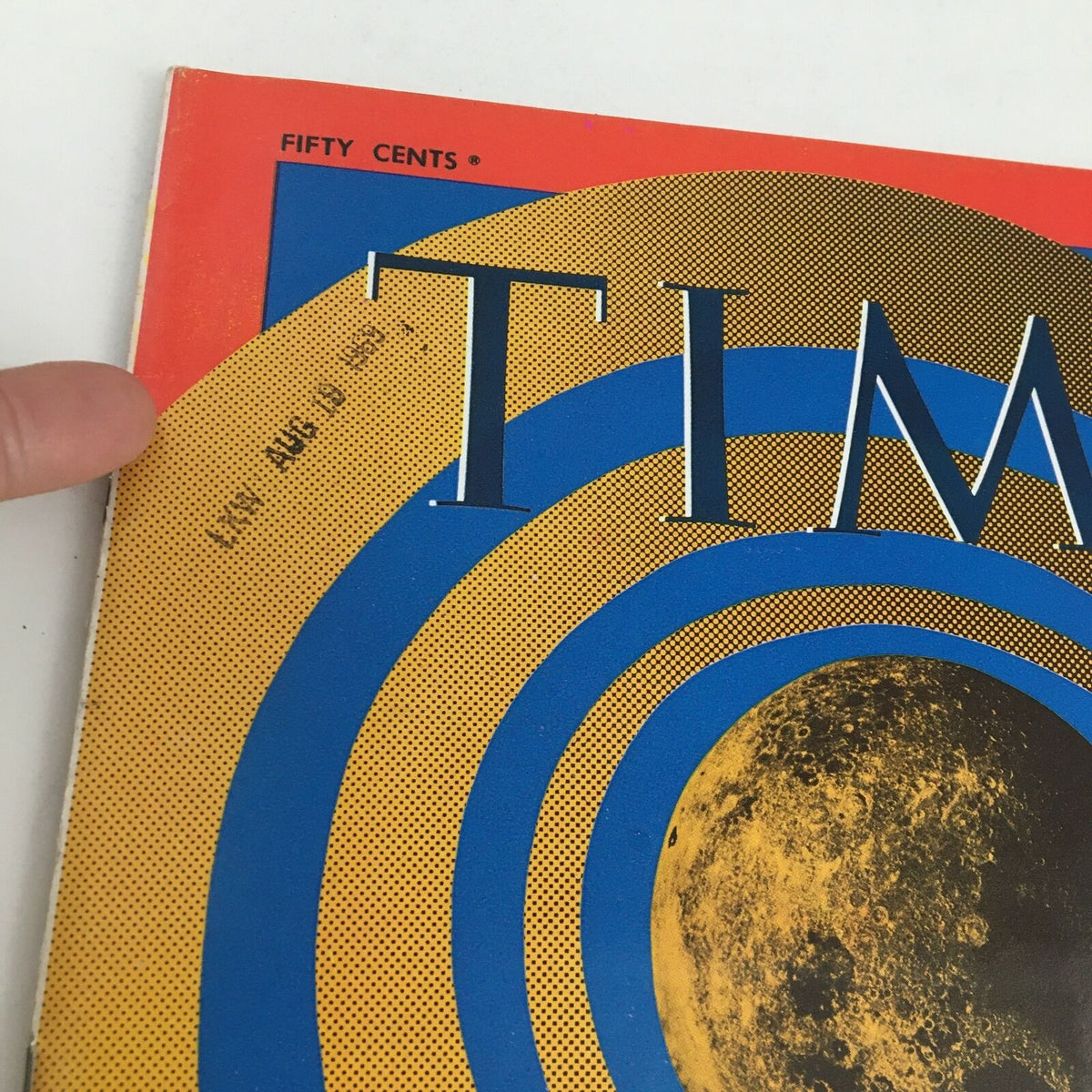 Close-up of the Time Magazine July 18 1969 cover, highlighting the 'To The Moon' title and a date stamp, emphasizing its historical significance.
