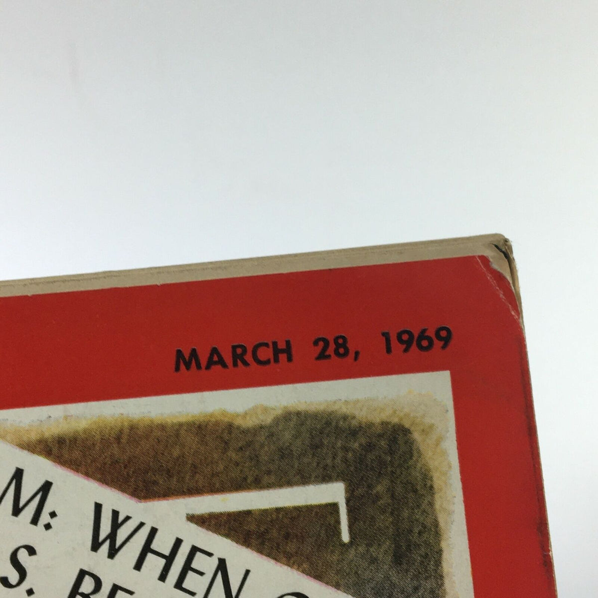 Top view of the spine of a VTG Time Magazine March 28 1969, displaying the publication date and a notable headline regarding Vietnam, indicating its historical context.
