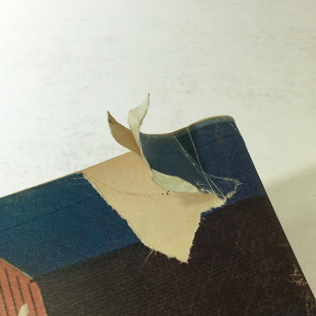 Close-up view of the damage on the back cover of the VTG Time Magazine March 4 1966, illustrating wear consistent with age, including a rip and paper peeling.