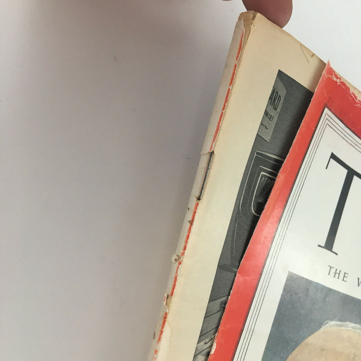 Close-up view of the spine and corner of the Time Magazine from November 24, 1952, Vol LX No. 21 featuring Marine Commandant Lemuel Shepherd, showing signs of wear and vintage characteristics.