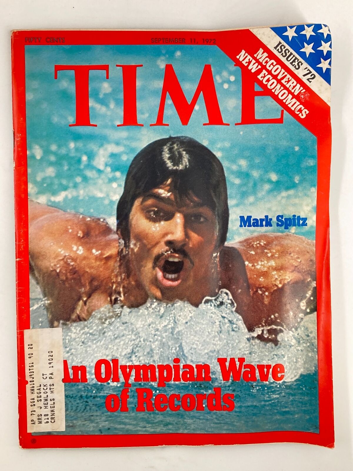 Cover of VTG Time Magazine September 11 1972 featuring Mark Spitz, an Olympic swimmer, depicting him in action with water splashing around, highlighting his achievements and the theme 'An Olympian Wave of Records'.