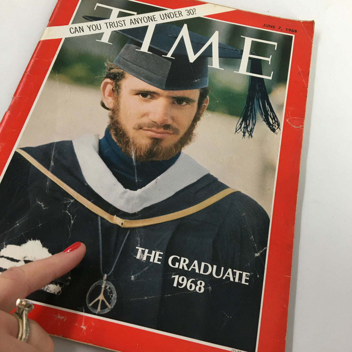 Close-up of the Vintage Time Magazine cover from June 7, 1968, titled 'The Graduates of Year 1968', depicting a graduate with a beard, graduation cap, and peace necklace.