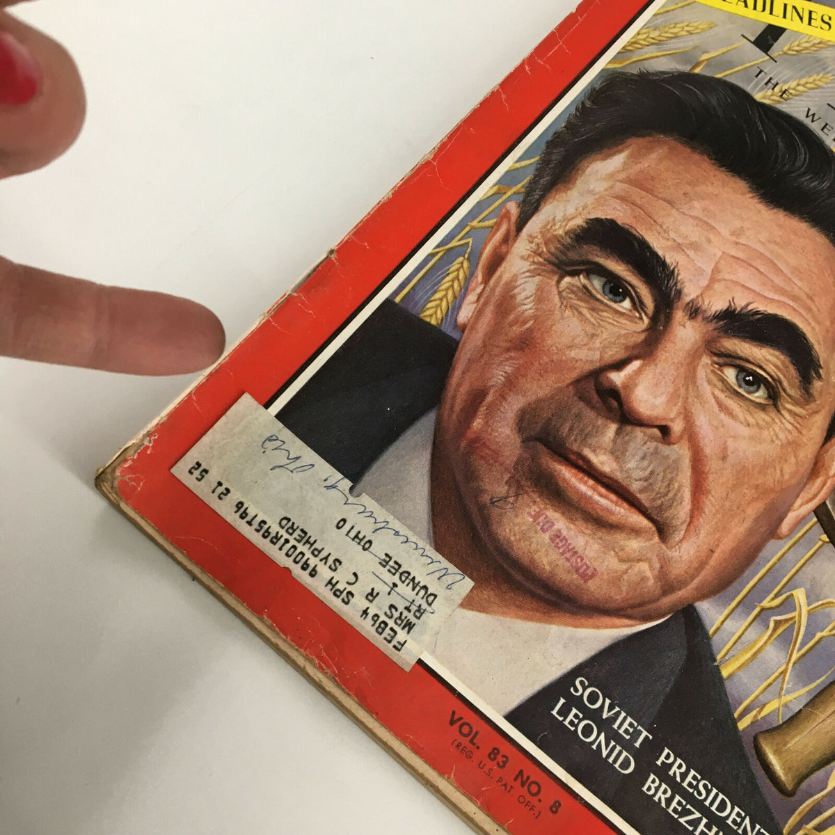 Close-up view of the cover of VTG Time Magazine February 21 1964 showcasing Soviet President Leonid Brezhnev, highlighting the magazine's vintage label and wear.