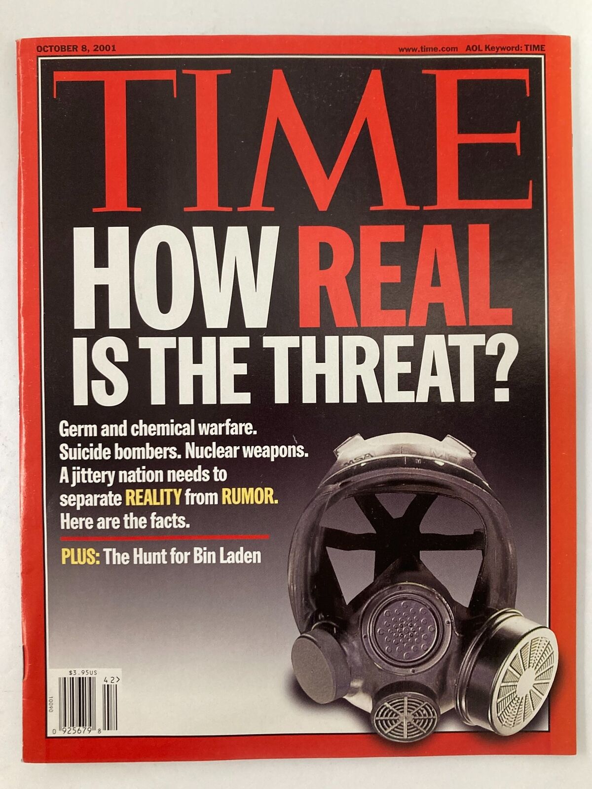 Time Magazine October 8 2001 cover featuring the headline 'How Real is the Threat?' with an image of a gas mask, discussing topics like germ warfare and the hunt for Osama bin Laden.