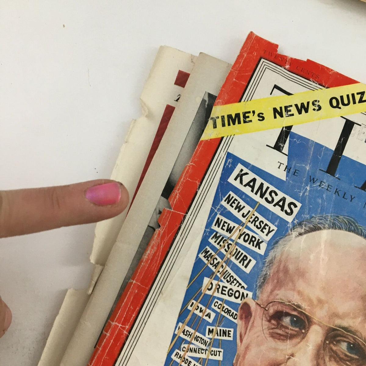 Detail of the Time Magazine from June 30, 1952, featuring American lawyer and judge John S. Fine. The cover shows worn edges, visible signs of age, and a finger pointing to a section of the magazine.