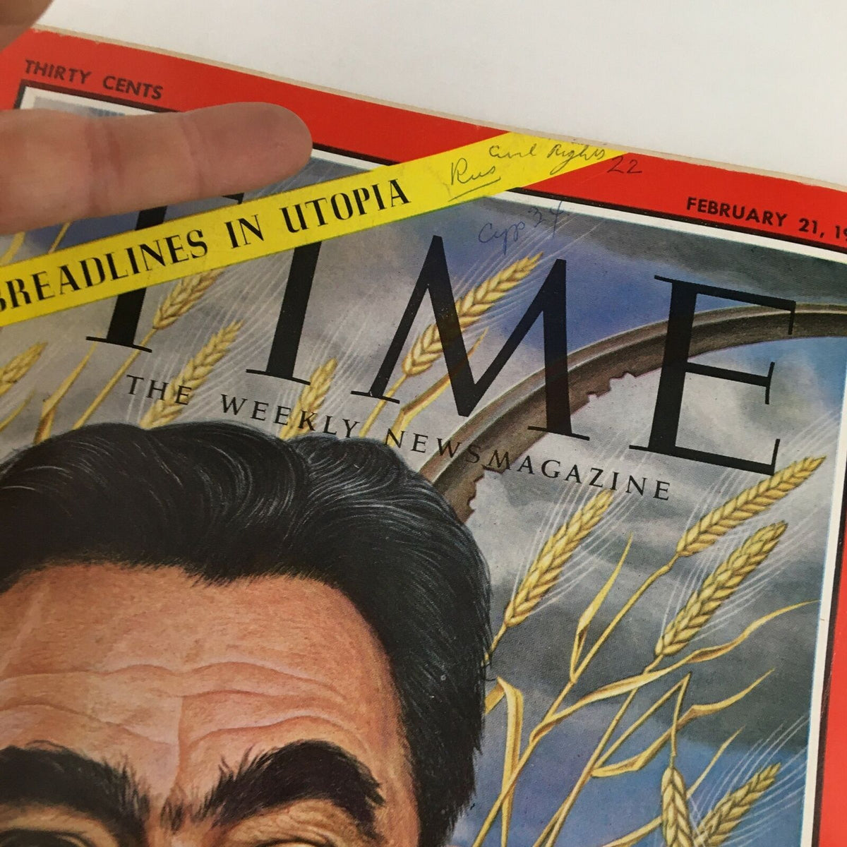 Close-up of the cover of Time Magazine February 21 1964 Vol. 83 No. 8 highlighting the title, date, and an inscription with the phrase 'Breadlines in Utopia'.