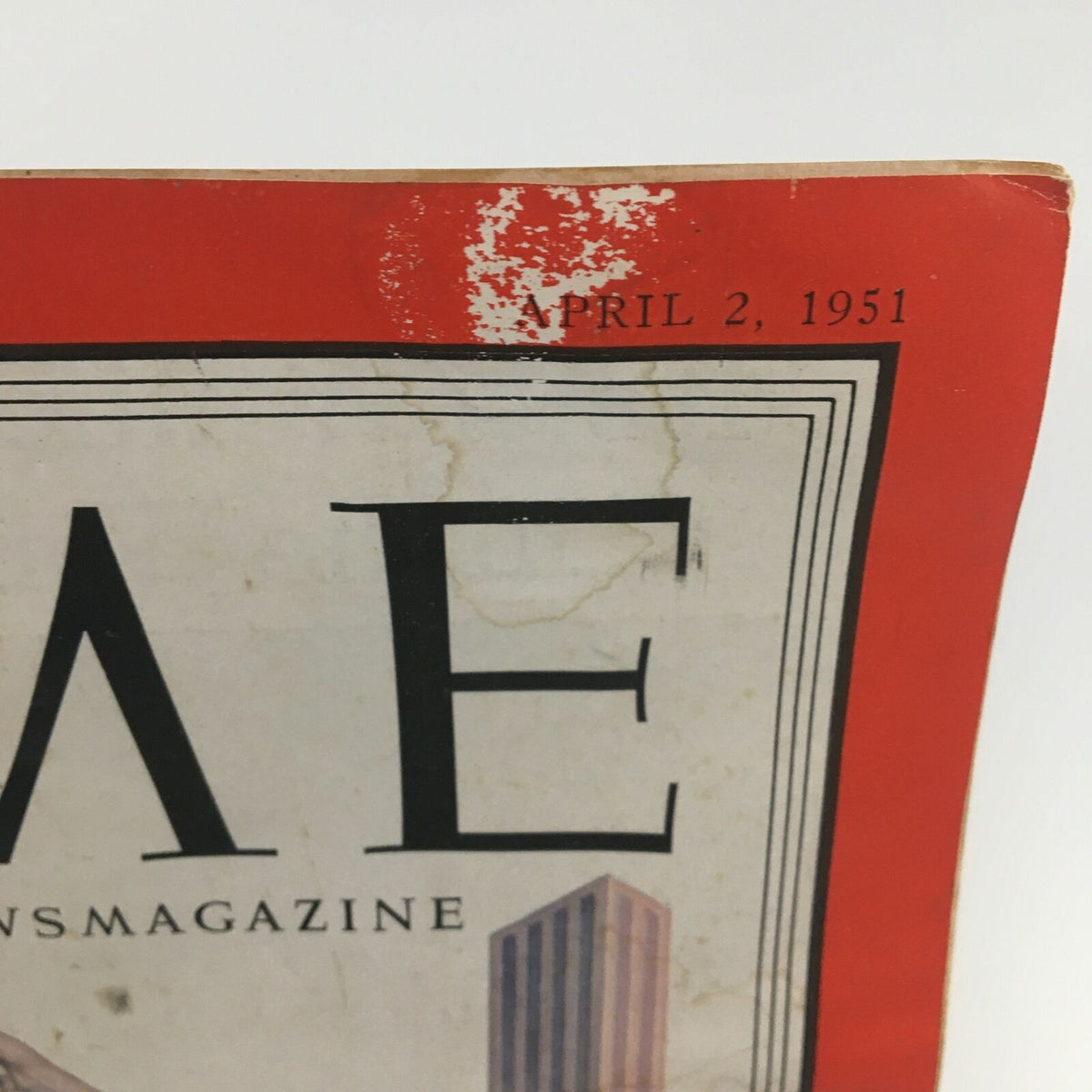 Close-up of the top corner of the Vintage Time Magazine from April 2, 1951, highlighting the date and noticeable wear with historical context relevant to its time.