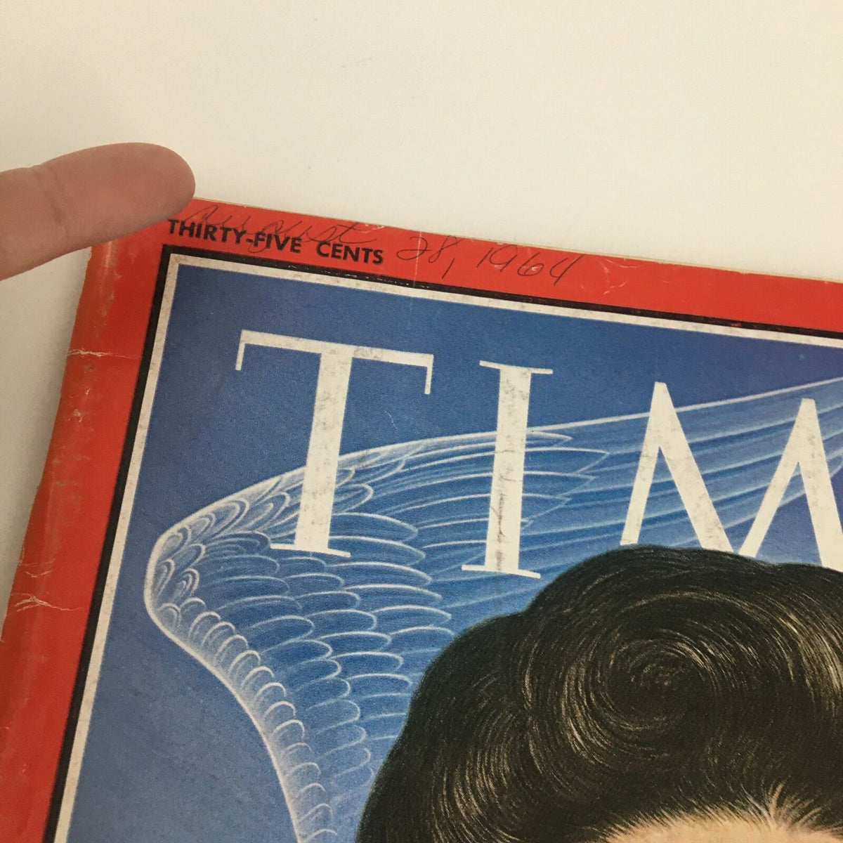 Close-up of the cover of 'Time Magazine August 28 1964', showing the date handwritten and vintage details.