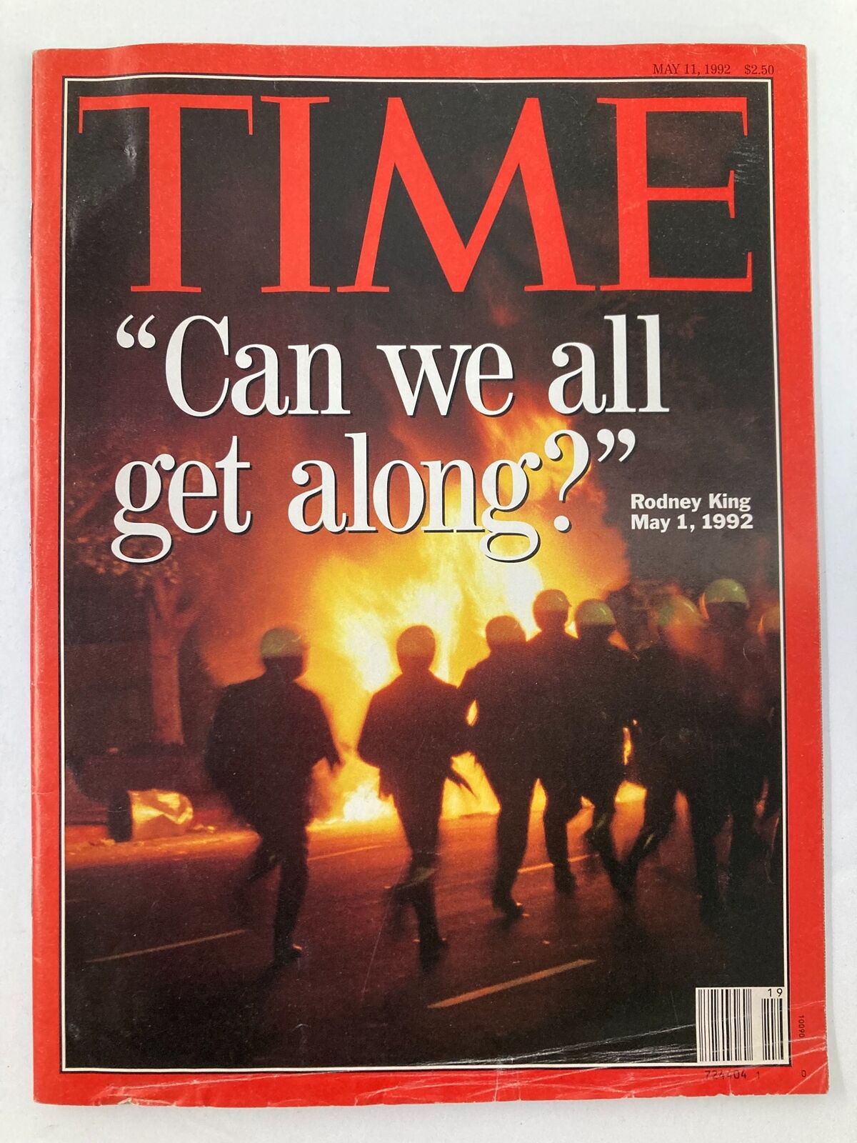 Cover of Time Magazine dated May 11, 1992, featuring the title 'Can We All Get Along?' related to Rodney King, showcasing silhouettes of people running in front of flames.
