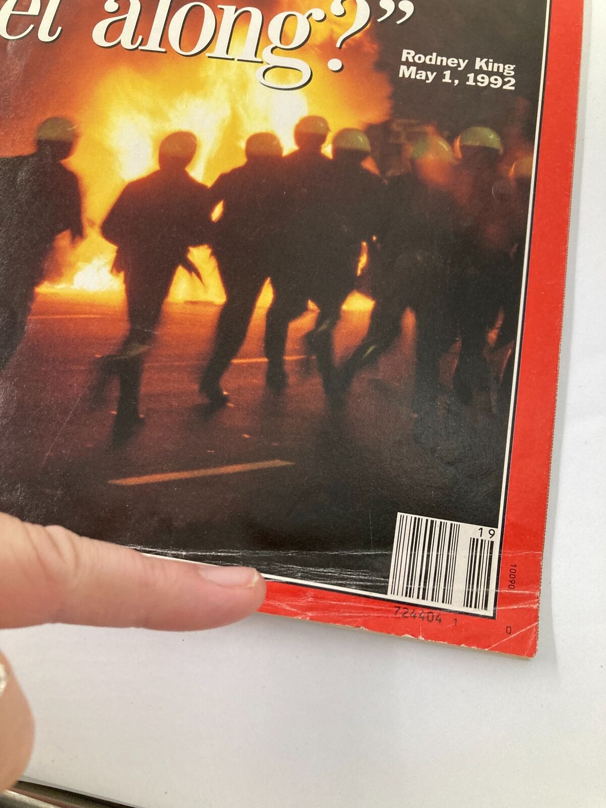 Close-up of the cover of Time Magazine dated May 11, 1992, highlighting the title 'Can We All Get Along?' about Rodney King, with emphasis on the magazine's edge and barcode.