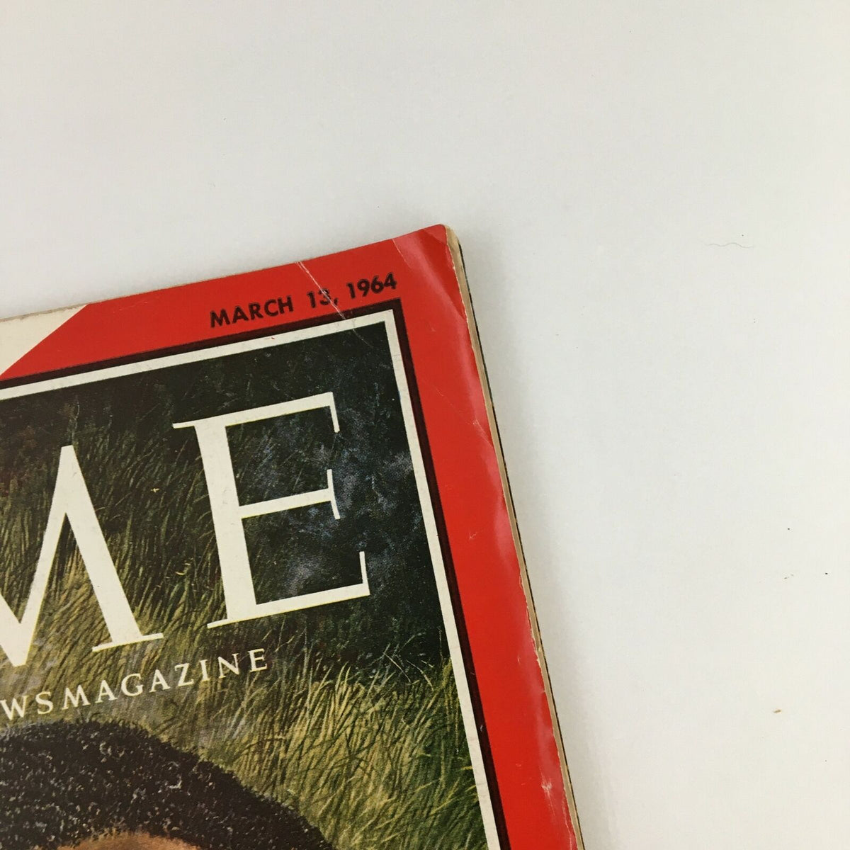 Side angle of Time Magazine March 13 1964 Vol. 83 No. 11, displaying the publication date and cover details under natural lighting.