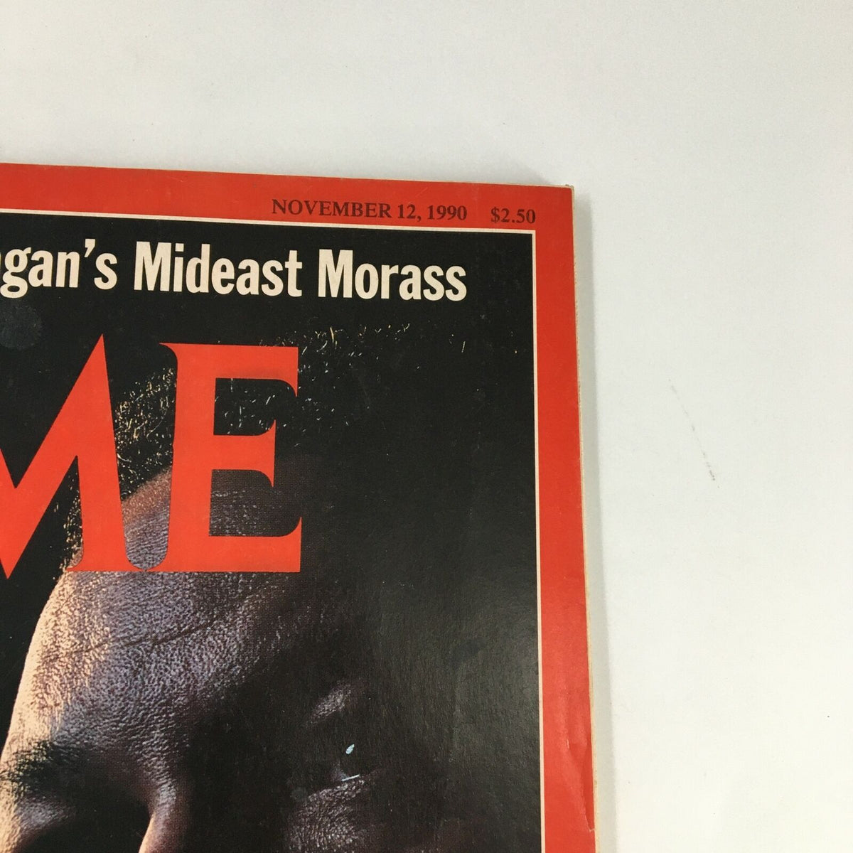 Close-up view of Time Magazine November 12, 1990 cover, highlighting the title and subtitle 'Reagan's Mideast Morass', featuring Dick Cheney and Colin Powell.