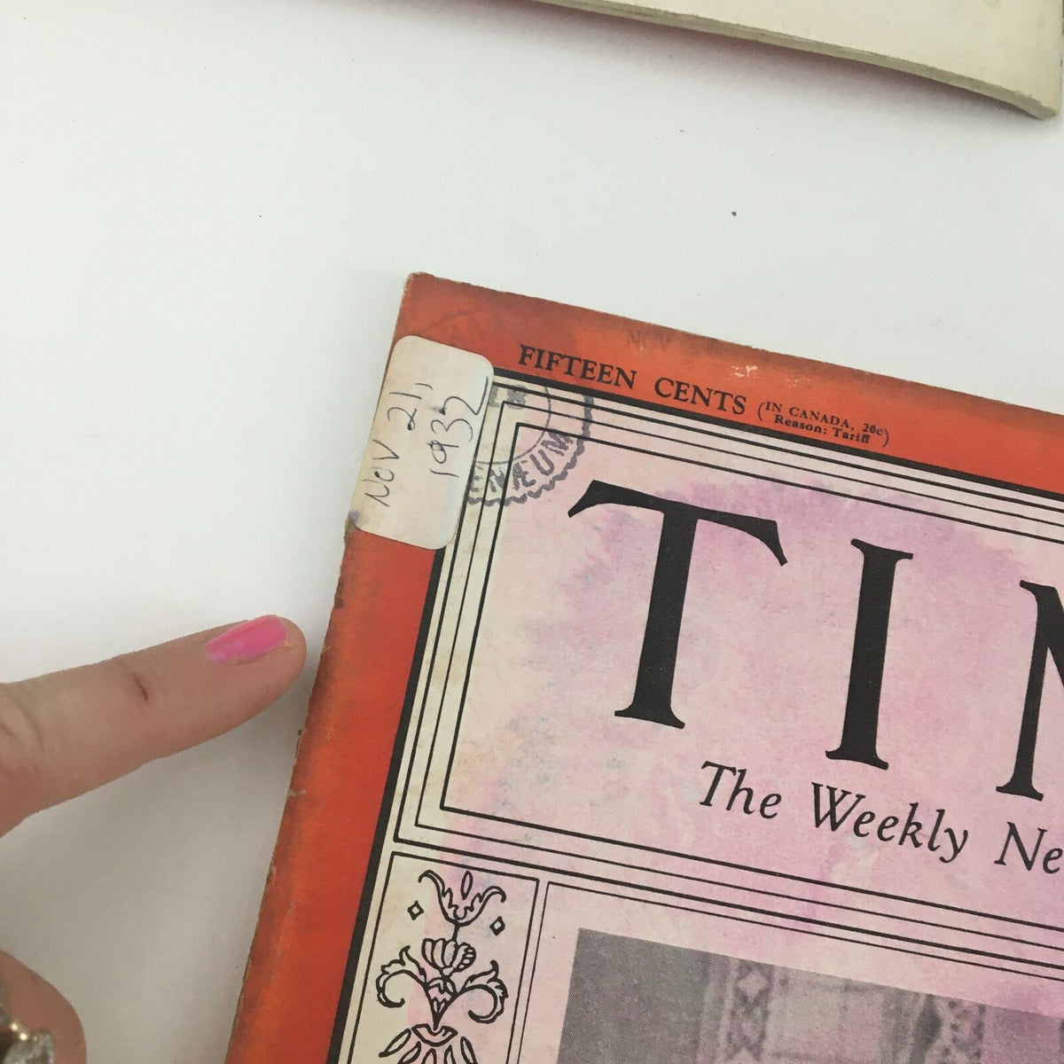 Closer view of the Time Magazine cover dated November 21 1932, highlighting the title and date while visible wear indicates its age and authenticity.