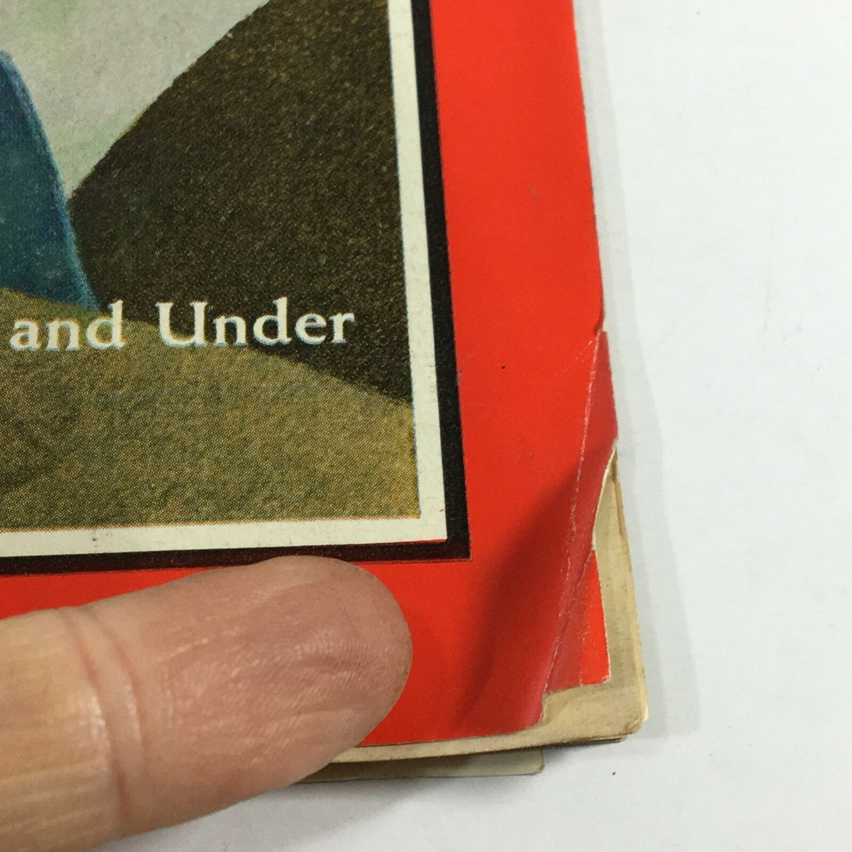 Close-up view of the edge of the vintage Time Magazine from January 6, 1967, highlighting minor wear and creases while displaying the title 'Twenty-five and Under'.