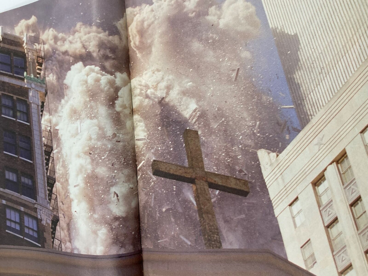 Time Magazine September 11 2001 The Twin Tower Attack 9-11 - A powerful image of dust and debris clouding the scene following the collapse of the Twin Towers, with a cross in the foreground.