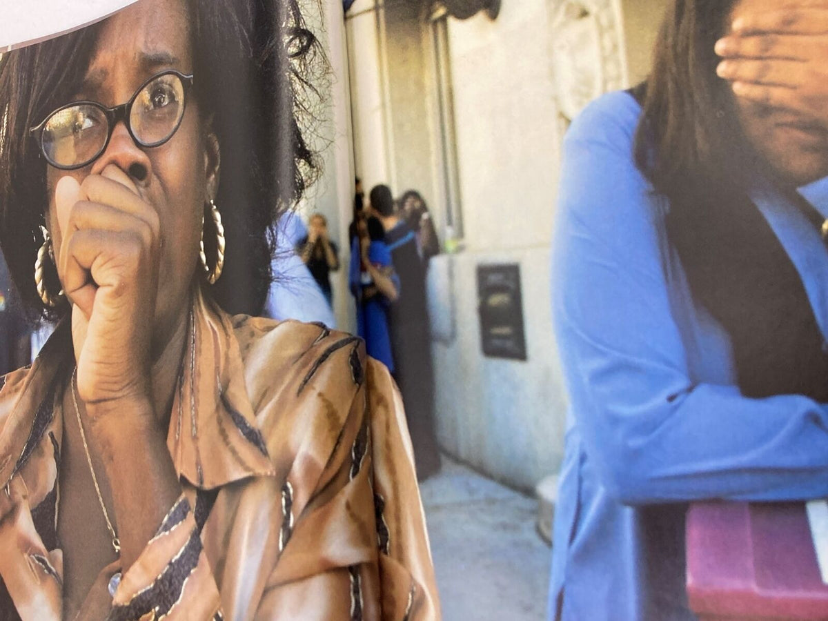 Emotional scenes captured in Time Magazine September 11 2001 The Twin Tower Attack 9-11, showing individuals reacting to the tragedy with expressions of shock and sorrow.