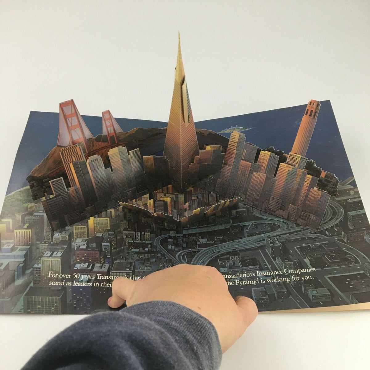 Pop-up illustration from a magazine featuring a detailed architectural skyline with the Transamerica Pyramid and the Golden Gate Bridge, reflecting the vibrant urban landscape of San Francisco, VTG Time Magazine September 8 1986.