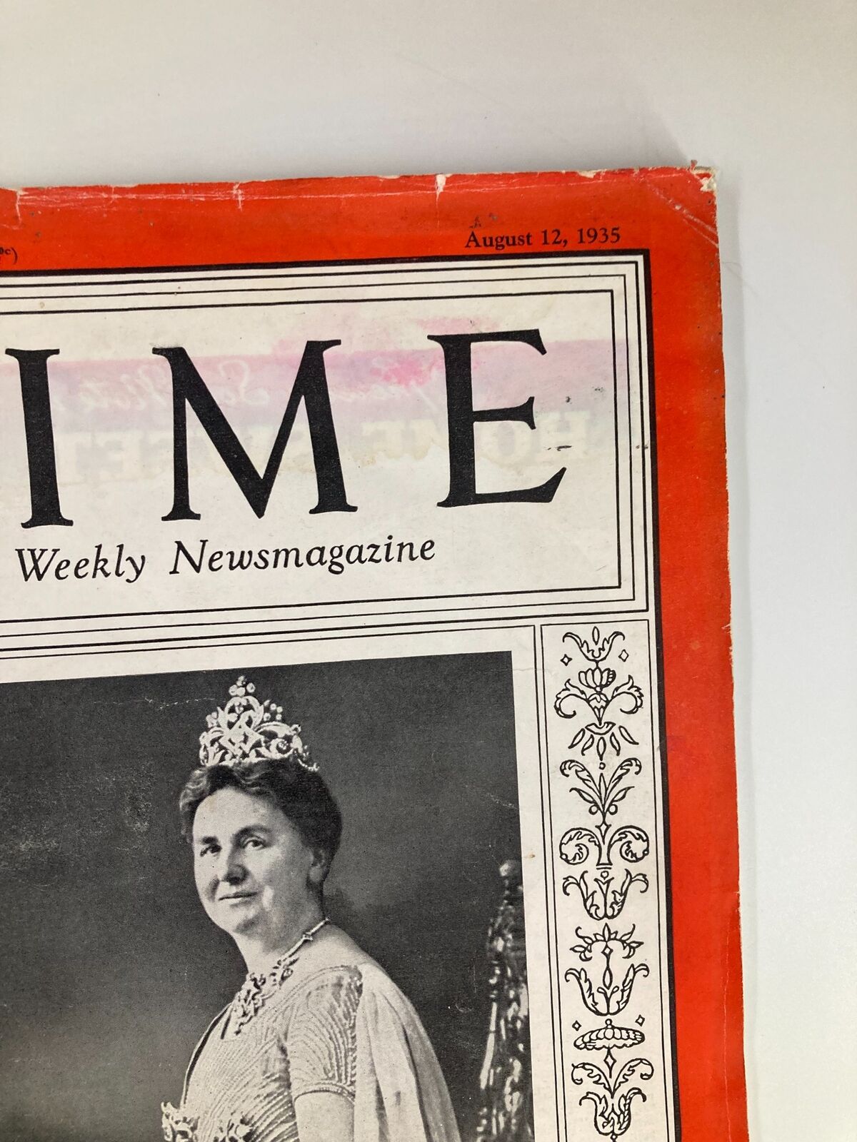 Close-up of the vintage Time Magazine dated August 12, 1935, featuring the title prominently and an image of the Queen of the Netherlands.