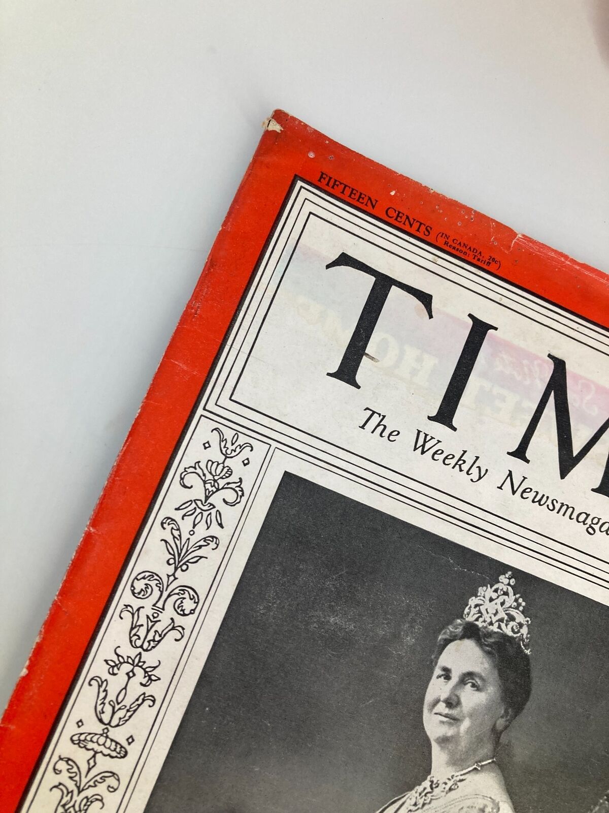 Detailed view of the corner of the vintage Time Magazine from August 12, 1935, showcasing the iconic red border and the title 'TIME'.