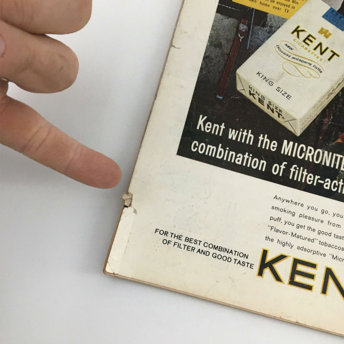 Detailed view of the back cover of VTG Time Magazine January 31, 1964, highlighting a Kent cigarette ad with visible wear, reflecting its vintage condition.