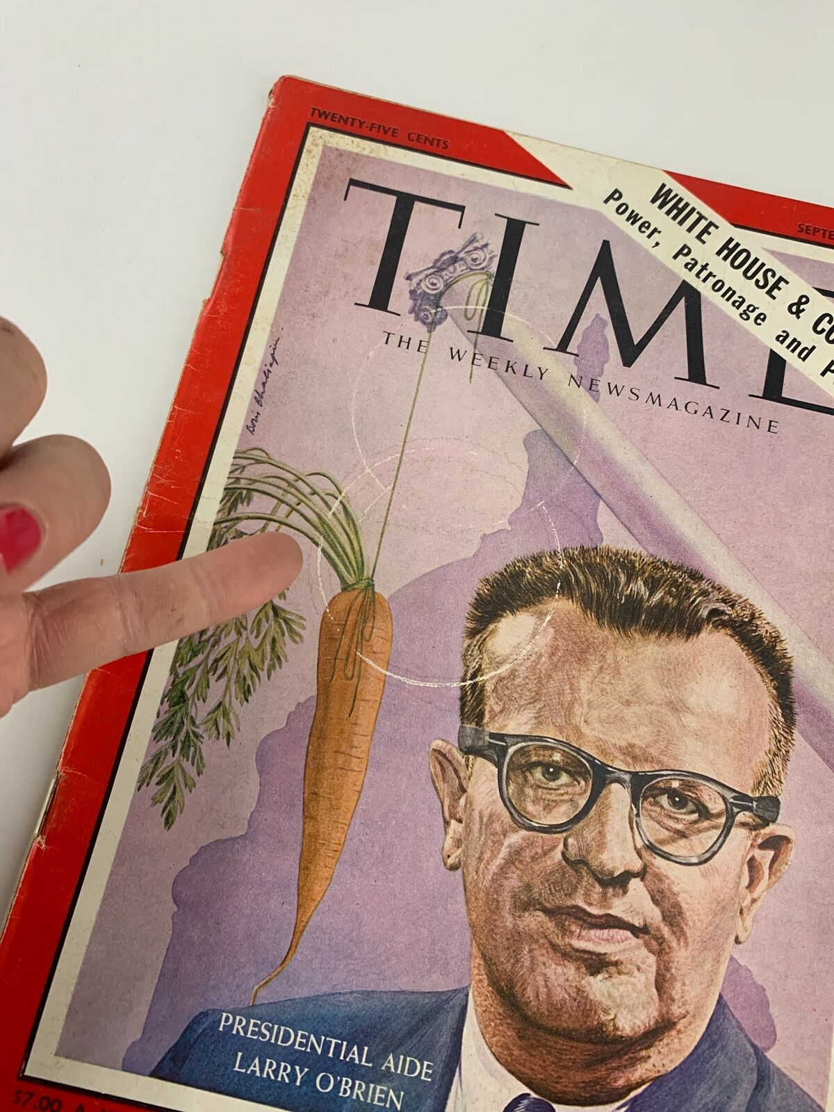 Close-up view of VTG Time Magazine September 1 1961 with a focus on the cover illustration of Presidential Aide Larry O'Brien and the unique carrot design.