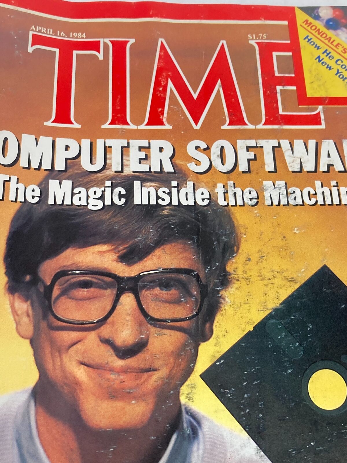Close-up of the vintage Time Magazine cover from April 16, 1984 with Bill Gates, titled 'The Magic Inside the Machine', highlighting computer software.