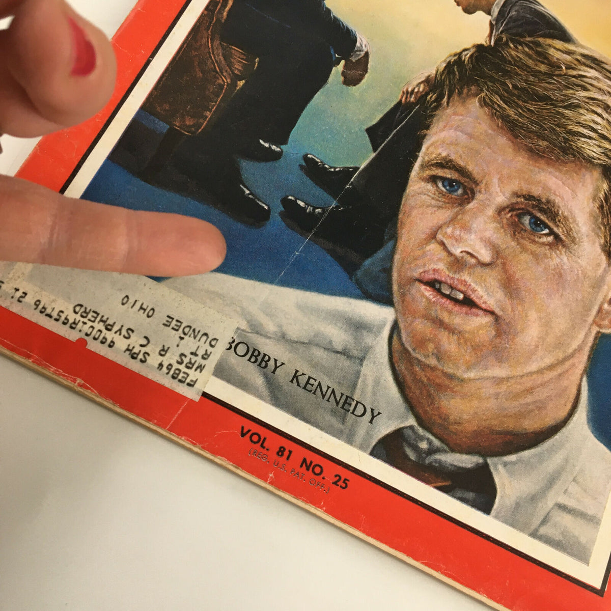 Close-up of the vintage Time Magazine cover from June 21, 1963, showing Bobby Kennedy with a visible label, Volume 82 Number 25.