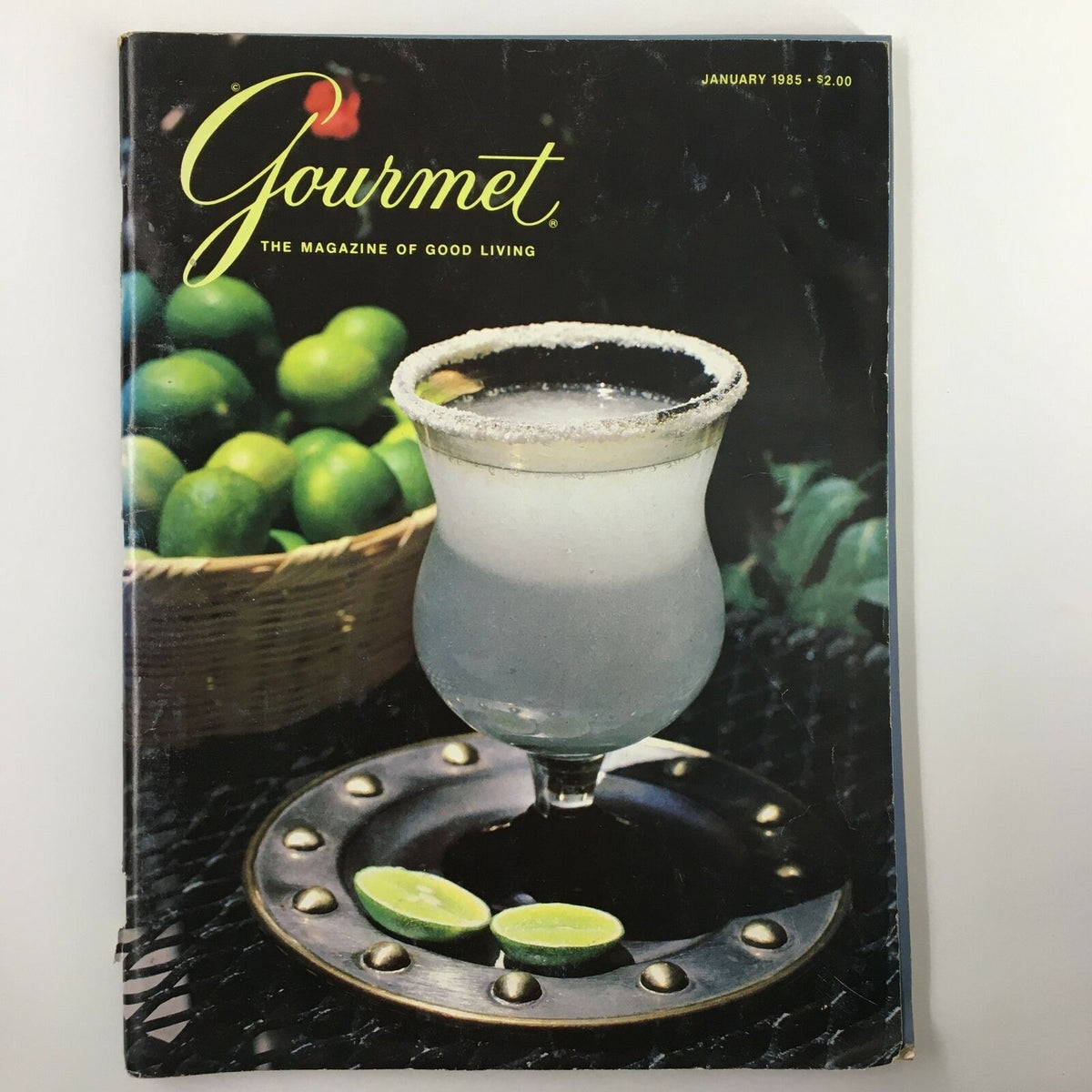 Cover of VTG Gourmet Magazine January 1985 featuring a classic margarita with limes, showcasing vintage food culture.