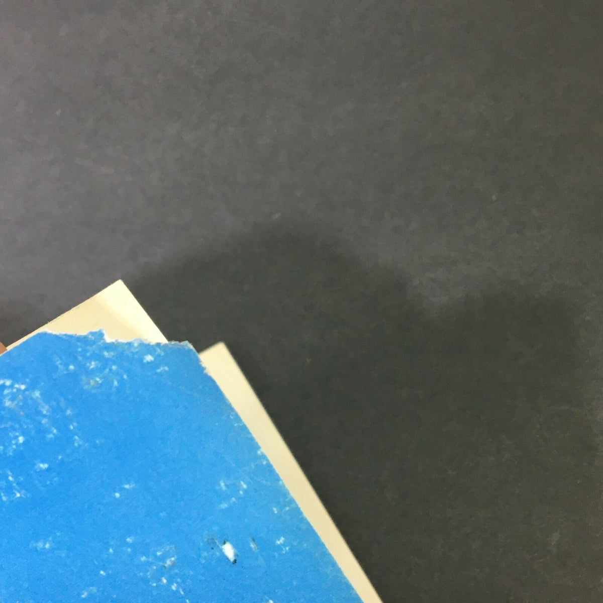 Close-up image of the top edge of a Cycle World Magazine March 1997 showing minor wear, including a blue label, indicating the magazine's vintage condition.