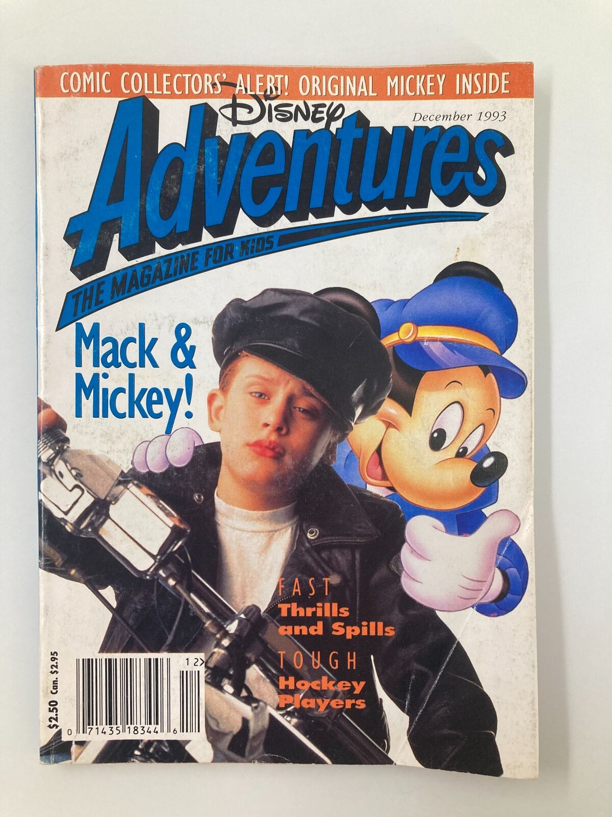 Cover of Disney Adventures Magazine December 1993 featuring Macaulay Culkin and Mickey Mouse, showcasing a vintage design with nostalgic elements and colorful graphics.