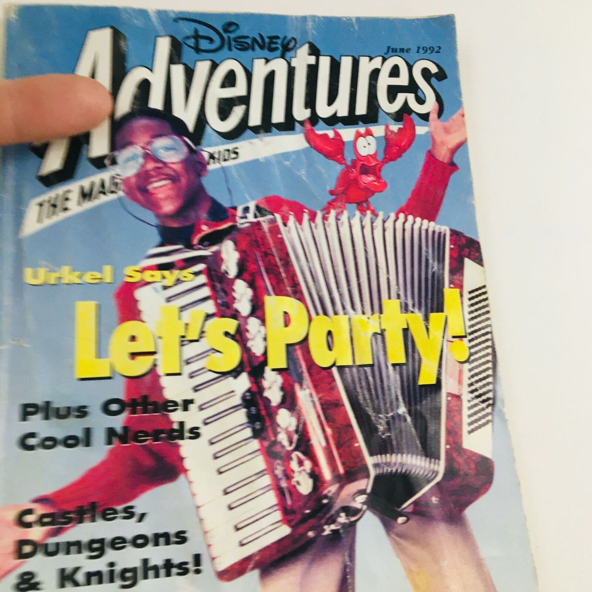 Close-up of the cover of Disney Adventures Magazine June 1992 showcasing Urkel from Family Matters with an accordion, prominent 'Let's Party!' text, and nostalgic Disney branding.