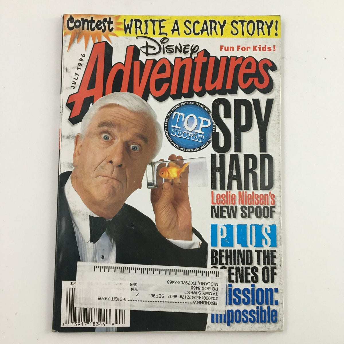 Disney Adventures Magazine July 1996 featuring Leslie Nielsen on the cover as Hapless Cop Frank Drebin, promoting 'Spy Hard' and including a contest for kids.