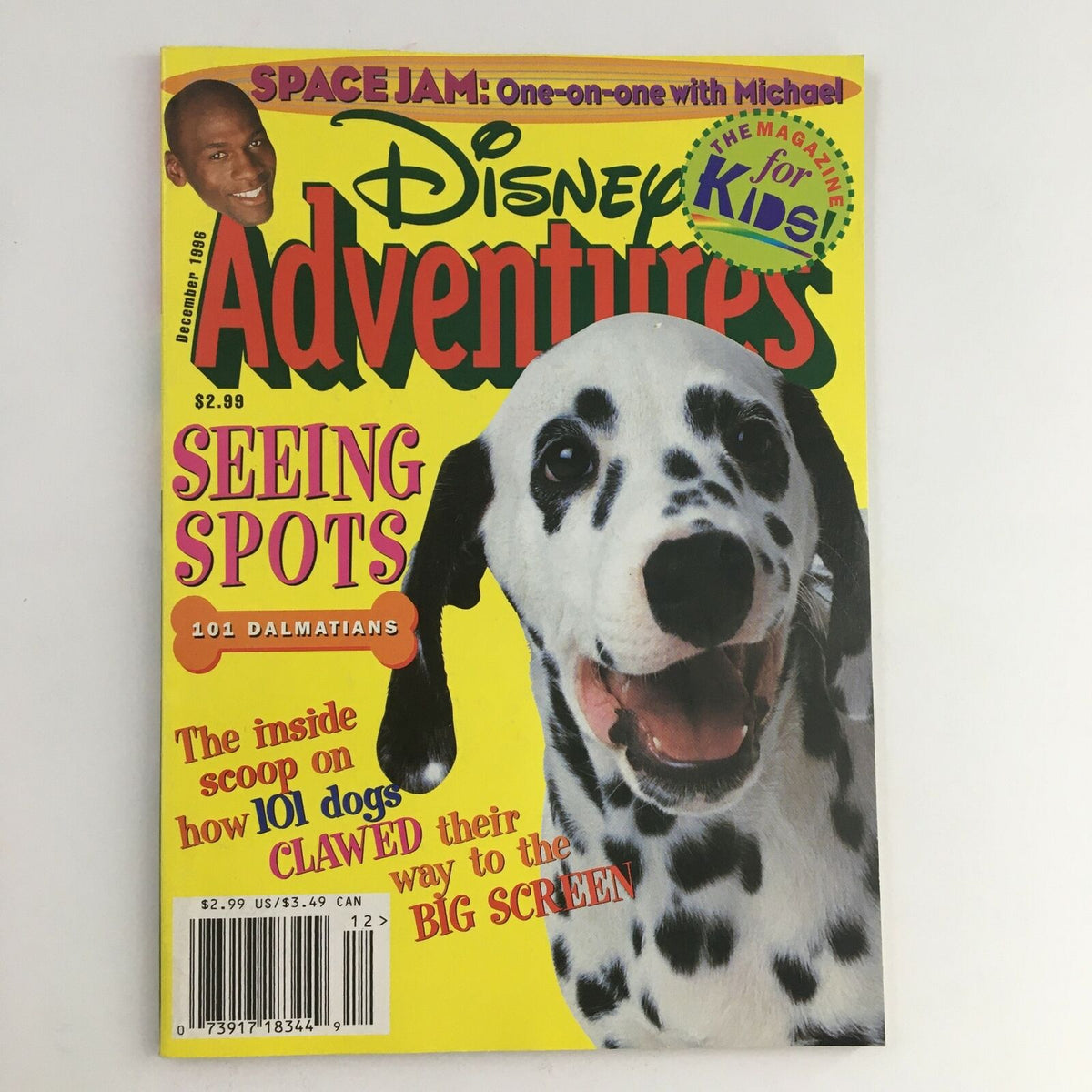 Disney Adventures Magazine December 1996 featuring Space Jam and Michael Jordan, with a vibrant cover showcasing a happy Dalmatian dog, highlighting 'Seeing Spots' with colorful text, perfect for collectors and fans of vintage Disney memorabilia.