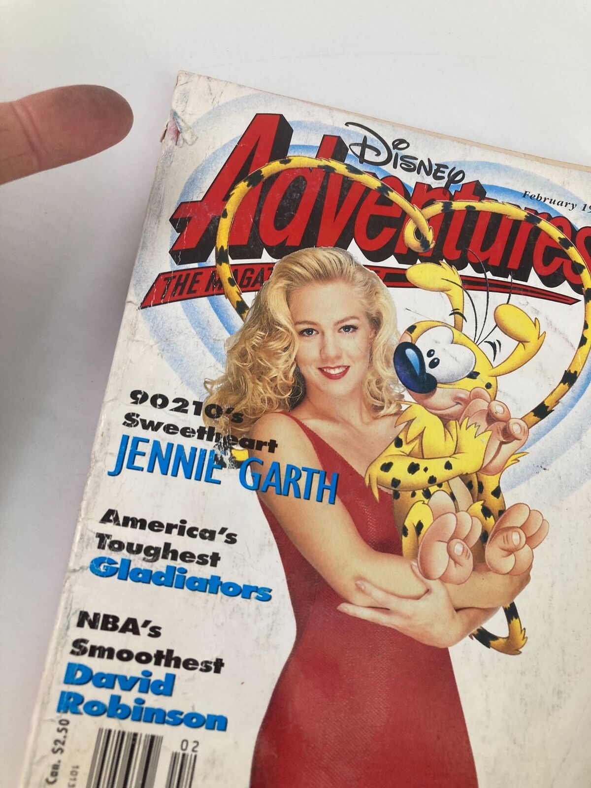 Close-up of the cover of Disney Adventures Magazine February 1993 showcasing Jennie Garth and the cartoon cheetah, along with mentions of David Robinson and the 90210 series.