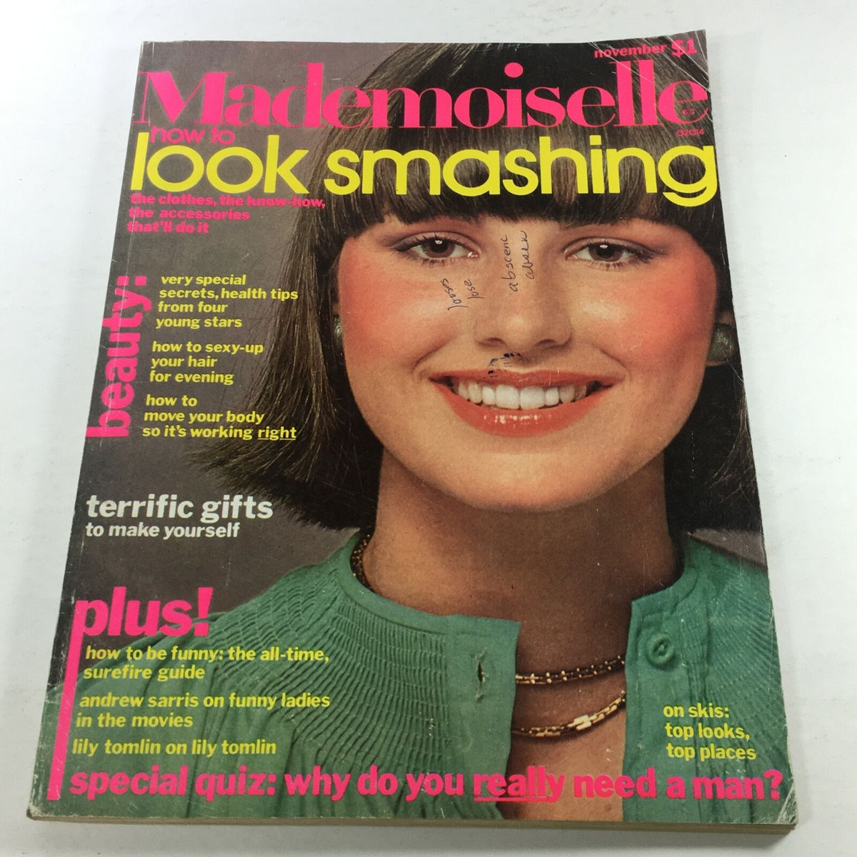 Vintage Mademoiselle Magazine Cover from November 1975, featuring a smiling model with a stylish haircut and wearing a green sweater, accompanied by colorful text highlighting beauty tips and fashion advice.