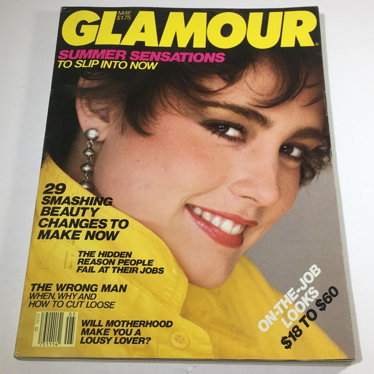 Glamour Magazine: May 1982 cover featuring Julie Wolfe with vibrant text highlighting articles on beauty, fashion, and lifestyle trends from the early 1980s.