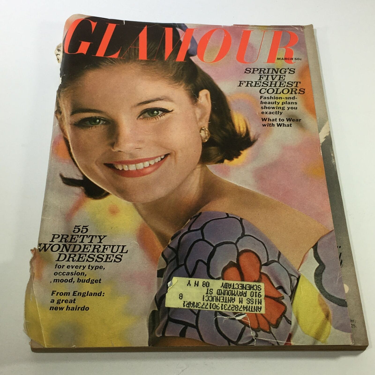 Cover of VTG Glamour Magazine: March 1964 showcasing '55 Pretty Wonderful Dresses' with vibrant colors and a smiling model, reflecting 1960s fashion and style.