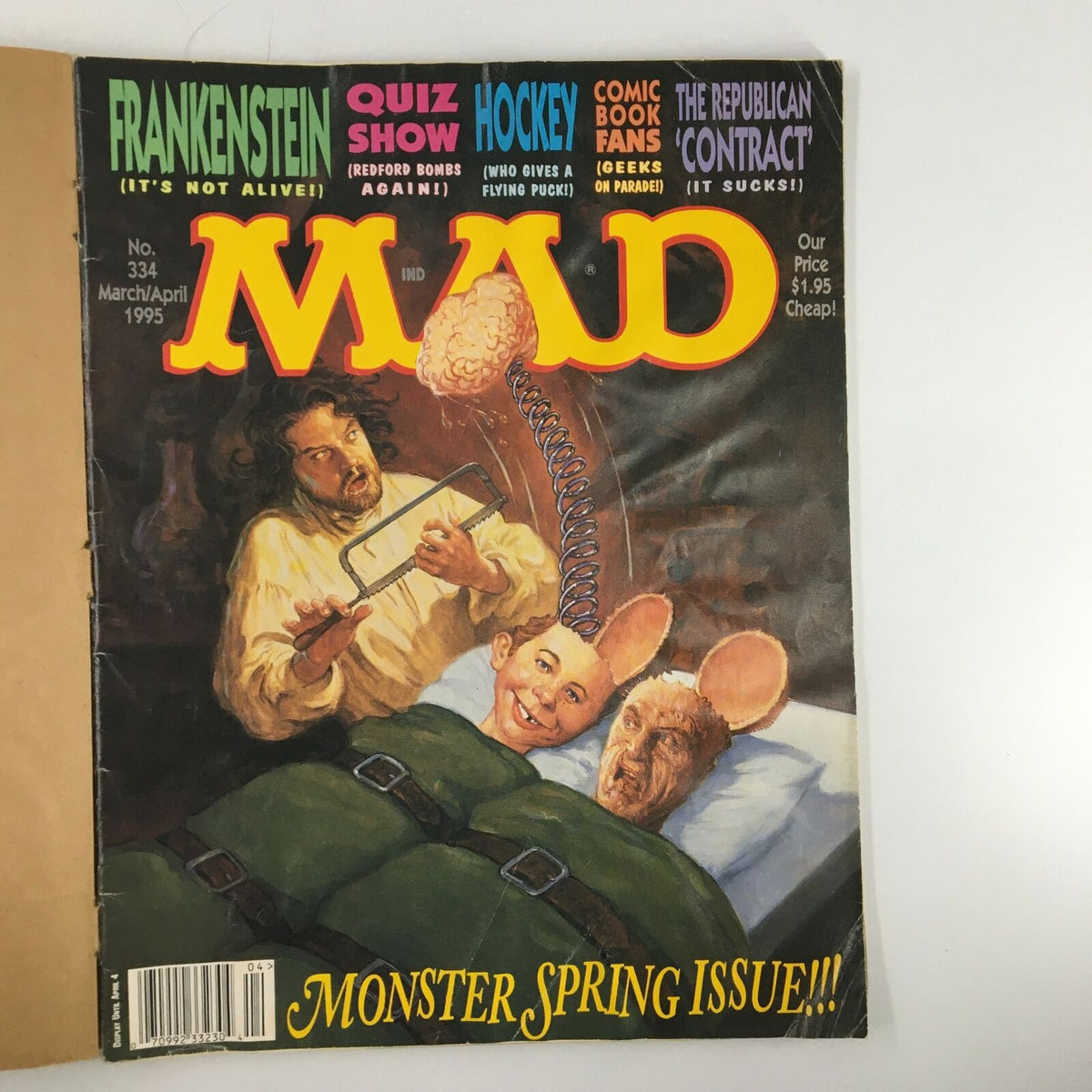 Mad Magazine March 1995 No. 334 featuring Frankenstein Monster cover. The artwork depicts a humorous scene with characters resembling a mad scientist and two creatures in bed. The magazine is titled 'Monster Spring Issue!!!' and showcases classic Mad Magazine satire from the 1990s.