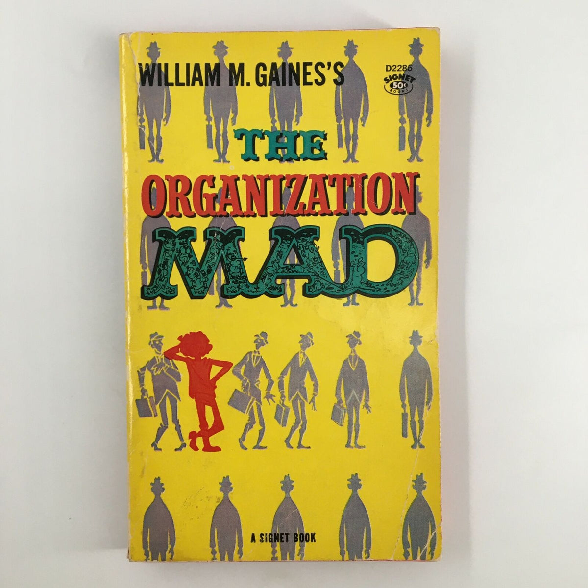 Cover of the 1960 William M. Gaines The Organization Mad Signet Book, featuring colorful illustrations and the title prominently displayed, showcasing vintage comic artistry.