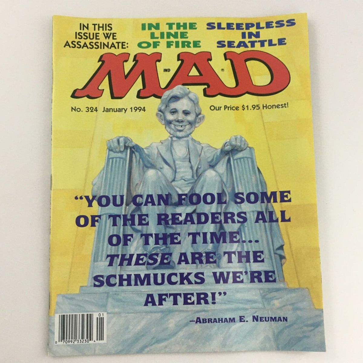 Mad Magazine January 1994 No. 324 featuring the humorous theme 'We Assassinate Abraham Neuman' on its cover, showcasing vibrant yellow background and iconic illustrations.