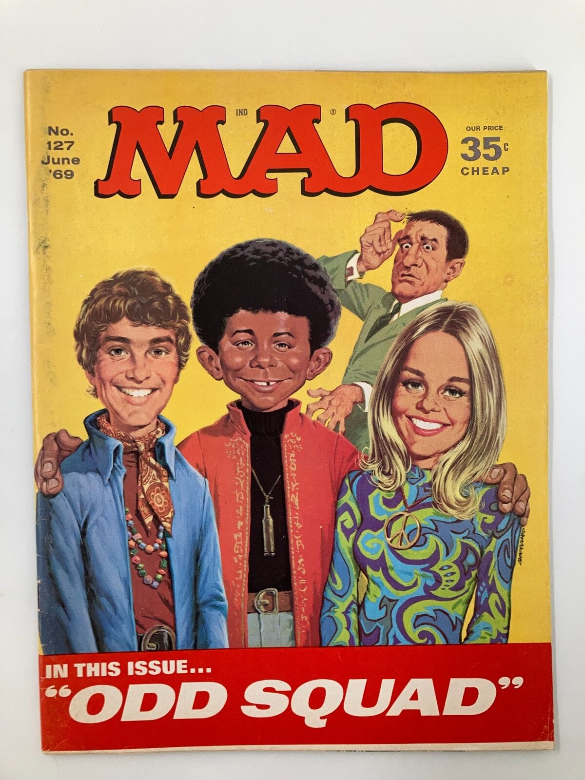 Cover of Mad Magazine June 1969 No. 127 featuring the title 'Odd Squad' with colorful illustrations of three characters and a vibrant yellow background.