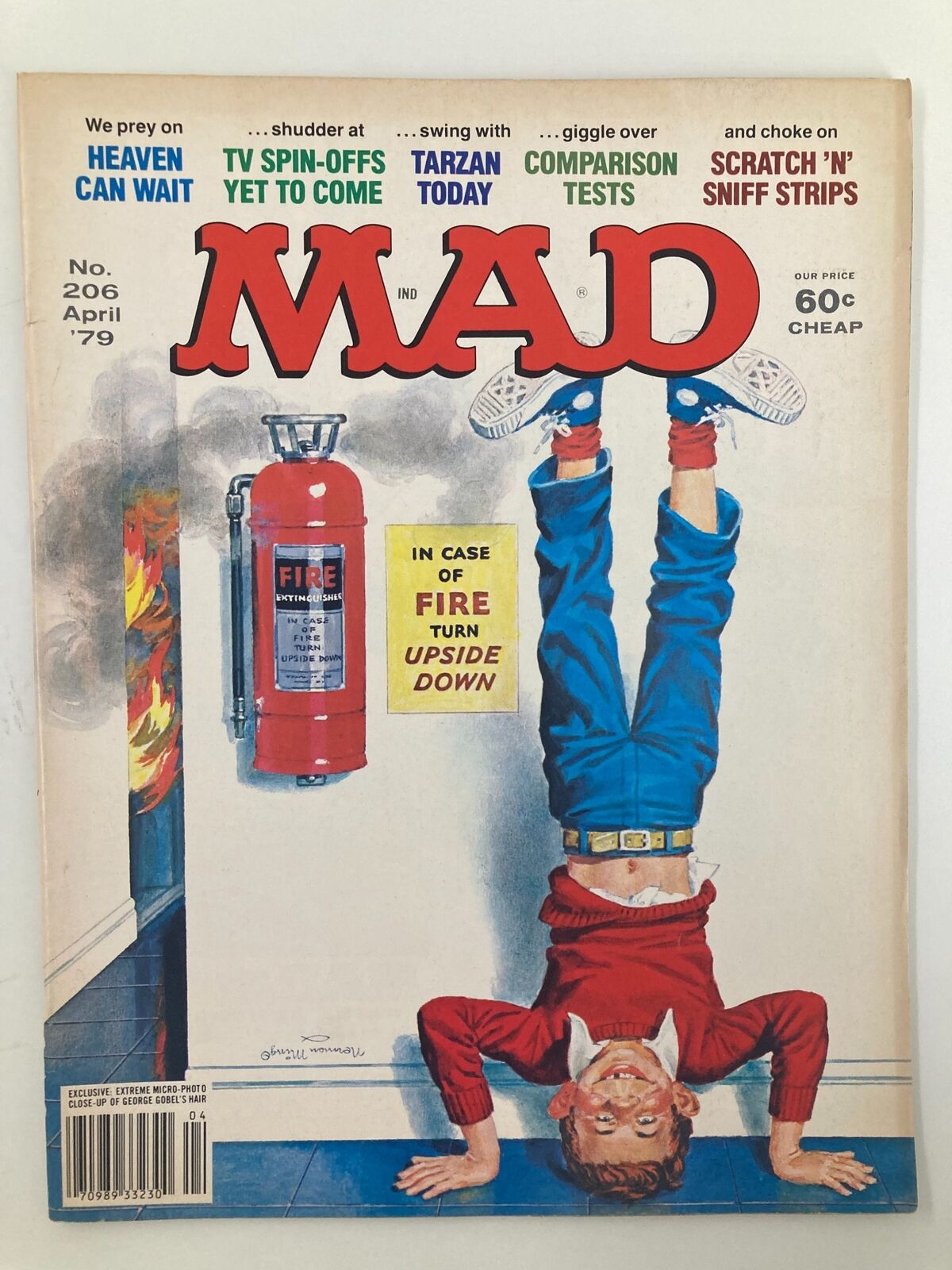 Cover of Mad Magazine April 1979 No. 206 featuring a boy standing on his hands with a playful 'Turn Upside Down' message, showcasing the magazine's unique design and humor.