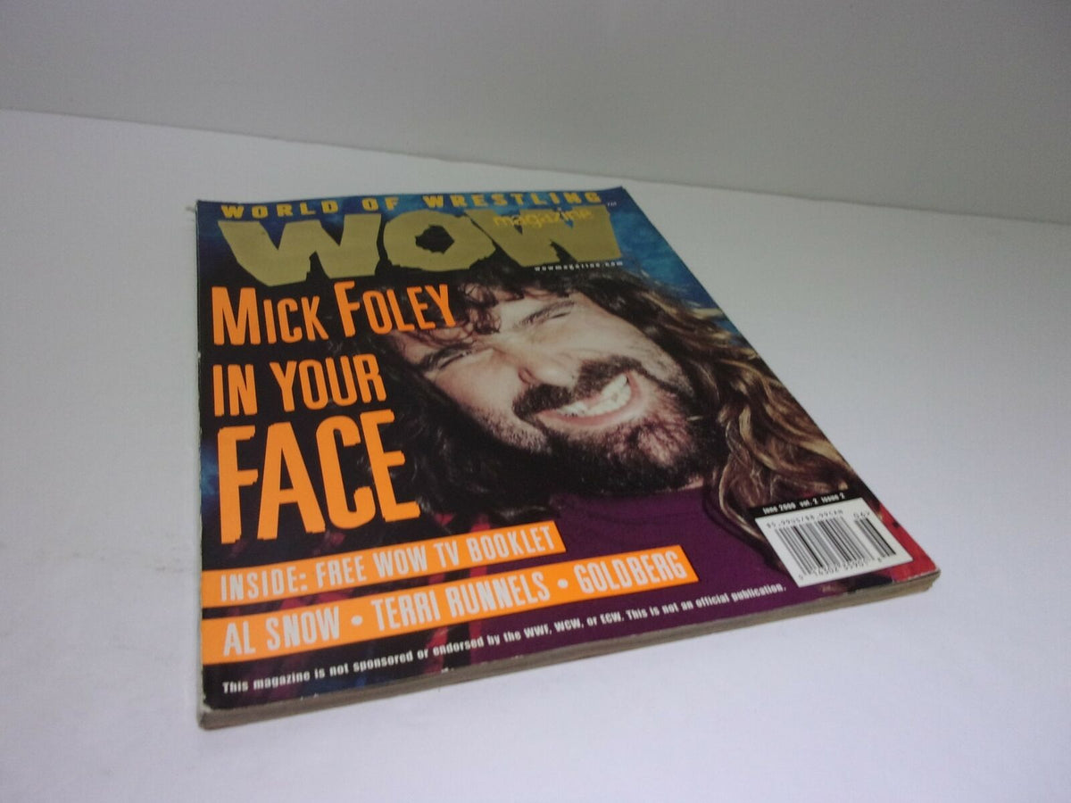 Cover of World of Wrestling WOW Magazine featuring Mick Foley titled 'Mick Foley In Your Face', showcasing vibrant colors and action-packed design.