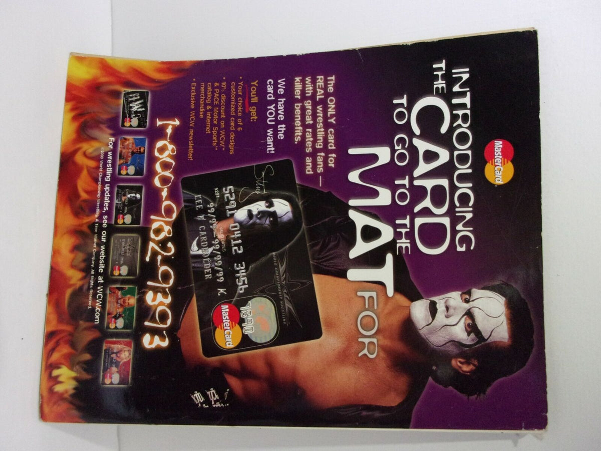 Advertisement page from World of Wrestling WOW Magazine promoting a special wrestling-themed Mastercard, 'the card to go to the mat for'.