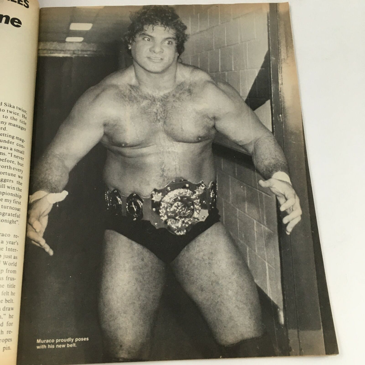 Wrestling's Main Event Magazine May 1983 page featuring a wrestler named Muraco proudly posing with his new championship belt, reflecting the era's wrestling culture.