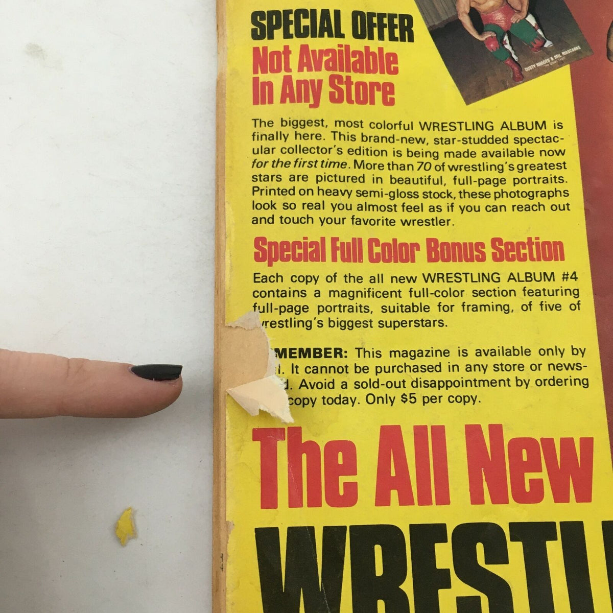 Close-up of the side cover of Wrestling Album #4, showing a tear with a special offer detail that it is not available in any store.