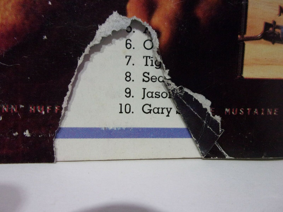 Another close-up view of the damaged edge of 'Ringside Wrestling: Undertaker "I'll drink Austin's Blood" October 1999', revealing section of the contents listed.