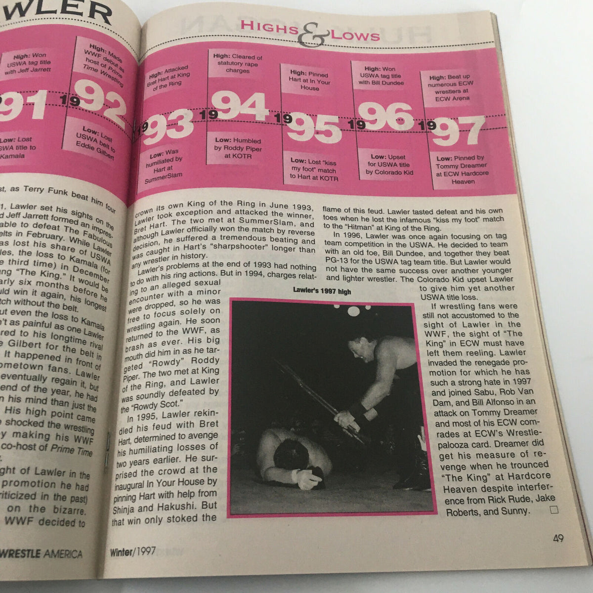 Highs and lows section from Wrestle America Magazine Winter 1997 discussing wrestler Jerry Lawler, including important matches and events.