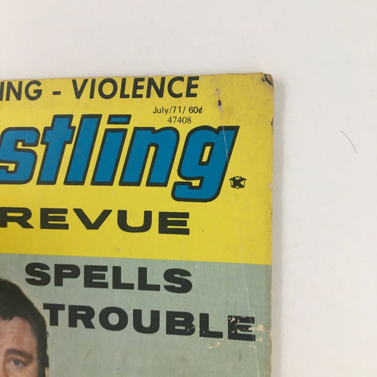 Upper detail of the Wrestling Revue Magazine July 1971 cover, showing the title and issue date, emphasizing its collectible nature.