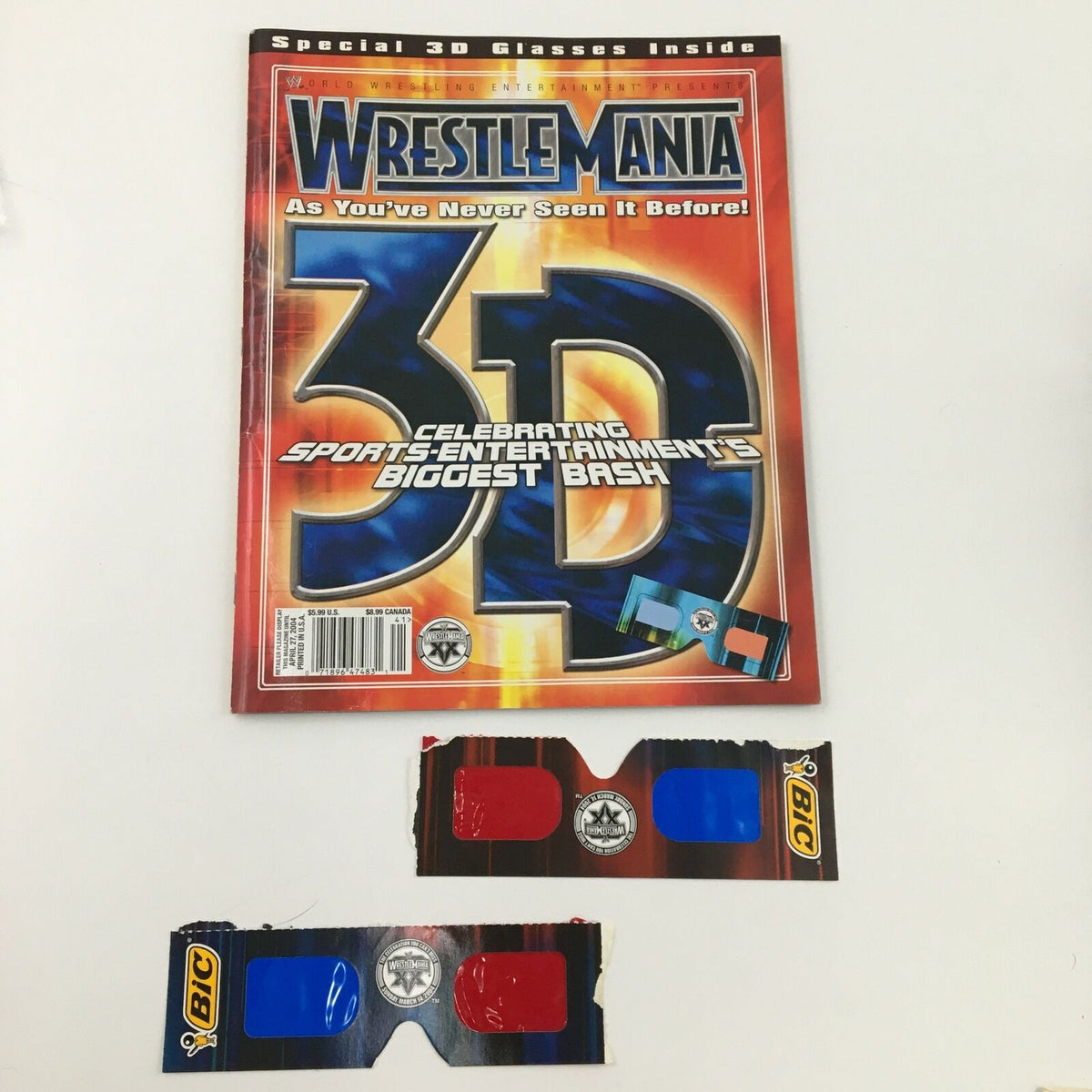 WWE Present 2004 Wrestle Mania magazine with 3D glasses, showcasing Hulk Hogan vs Sid Justice, celebrating sports entertainment's biggest bash.